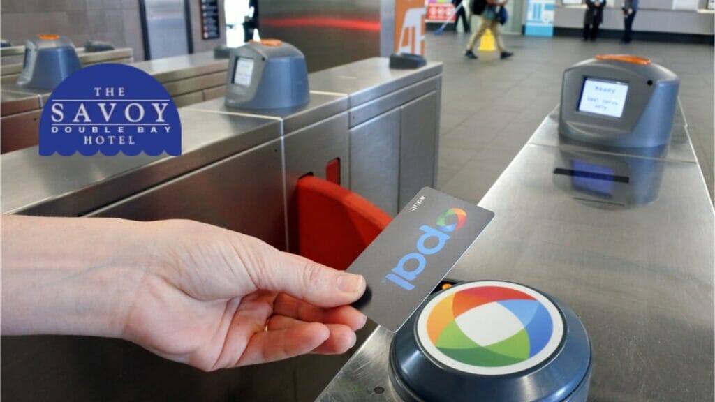 Best Way to Get Around Sydney - Sydney A hand tapping an Opal transport card onto a turnstile reader at a station.
