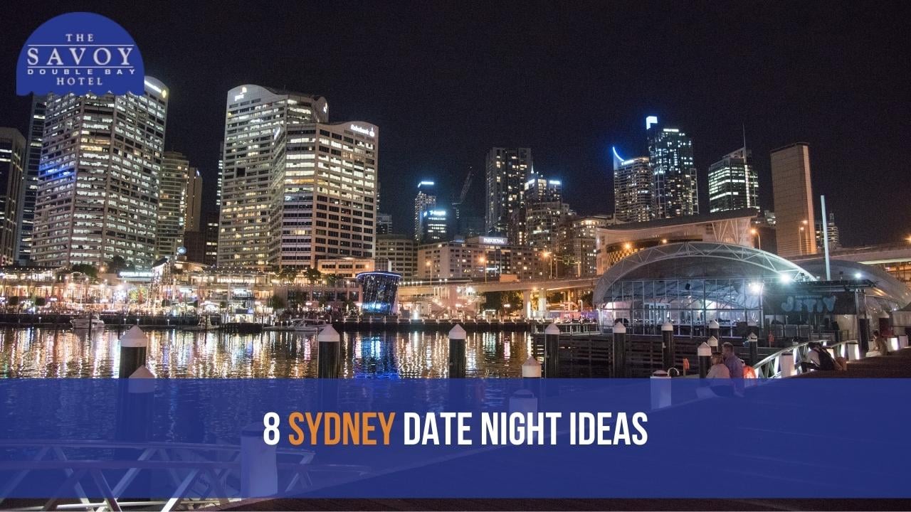 A nighttime view of Cockle Bay Wharf and the glittering city skyline at Darling Harbour in Sydney.