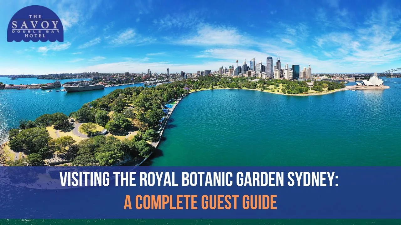 Aerial panorama of the Royal Botanic Garden Sydney beside Sydney Harbour and the CBD skyline.