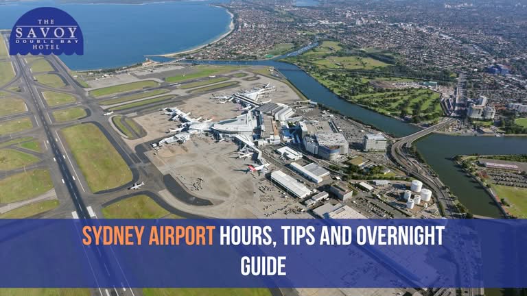 Aerial view of Sydney Airport with runways, terminals, and surrounding coastal landscape.