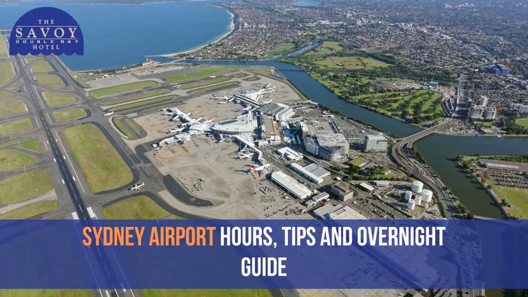 Aerial view of Sydney Airport with runways, terminals, and surrounding coastal landscape.