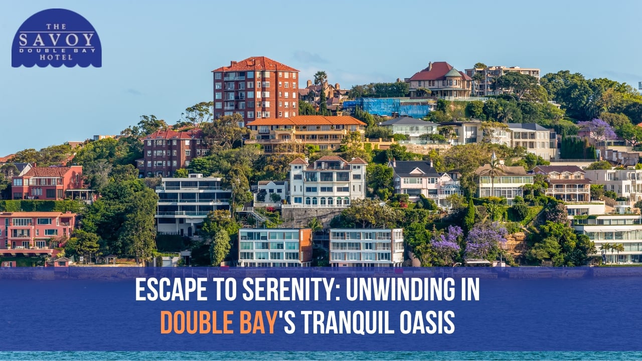 A lush, terraced hillside dotted with multi-storey apartment buildings and houses.