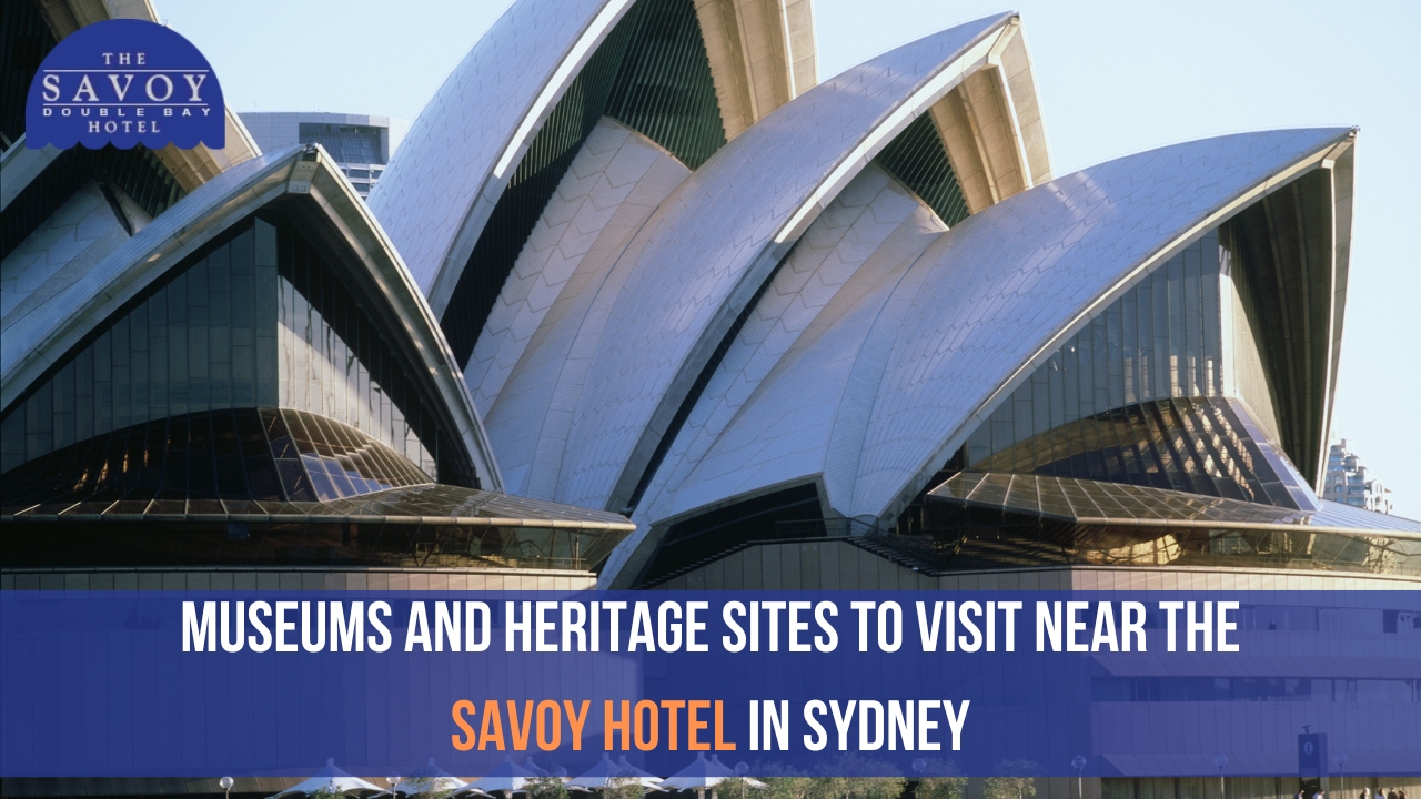 A close-up, dramatic angle of the white, sail-like structures of the Sydney Opera House.
