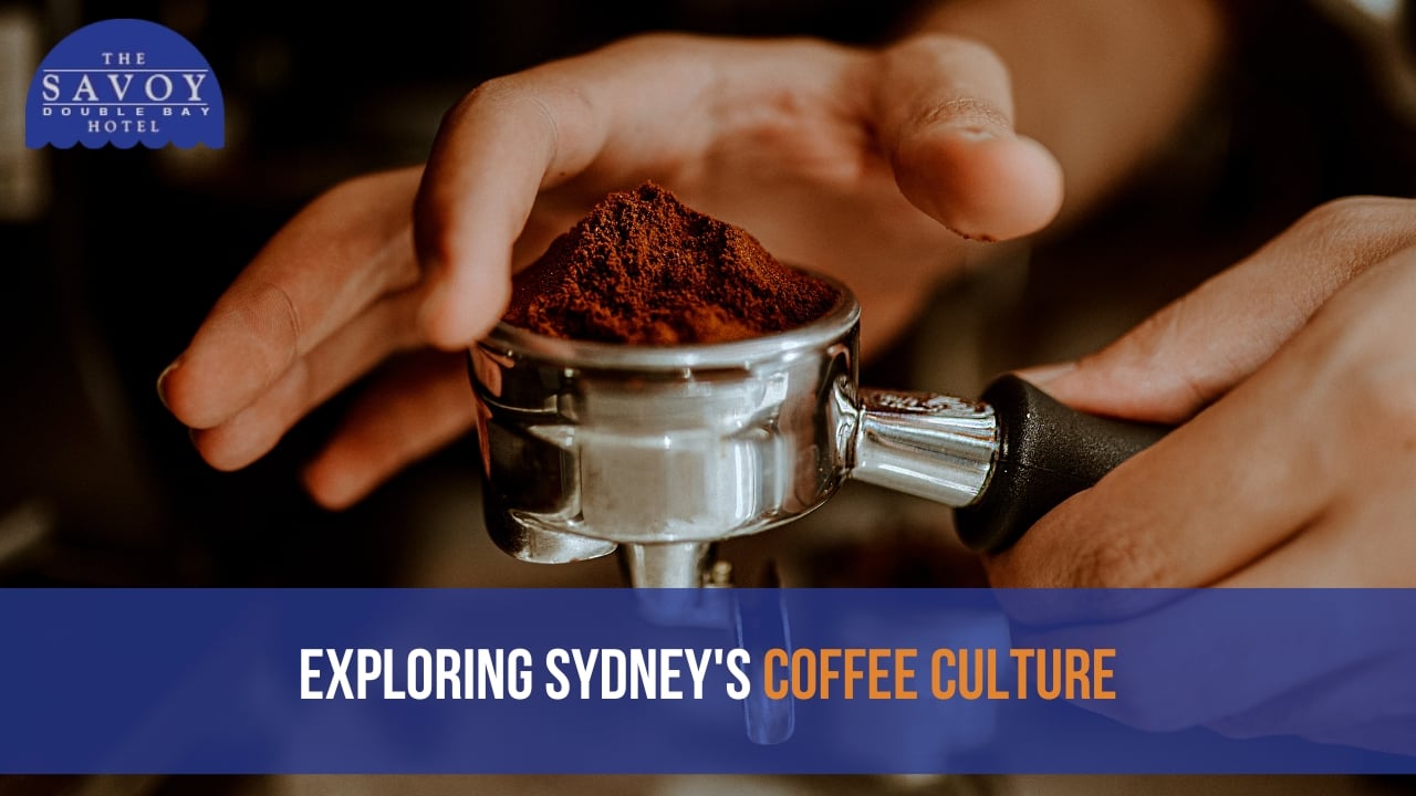A hand holding a porta filter with fine grind beans