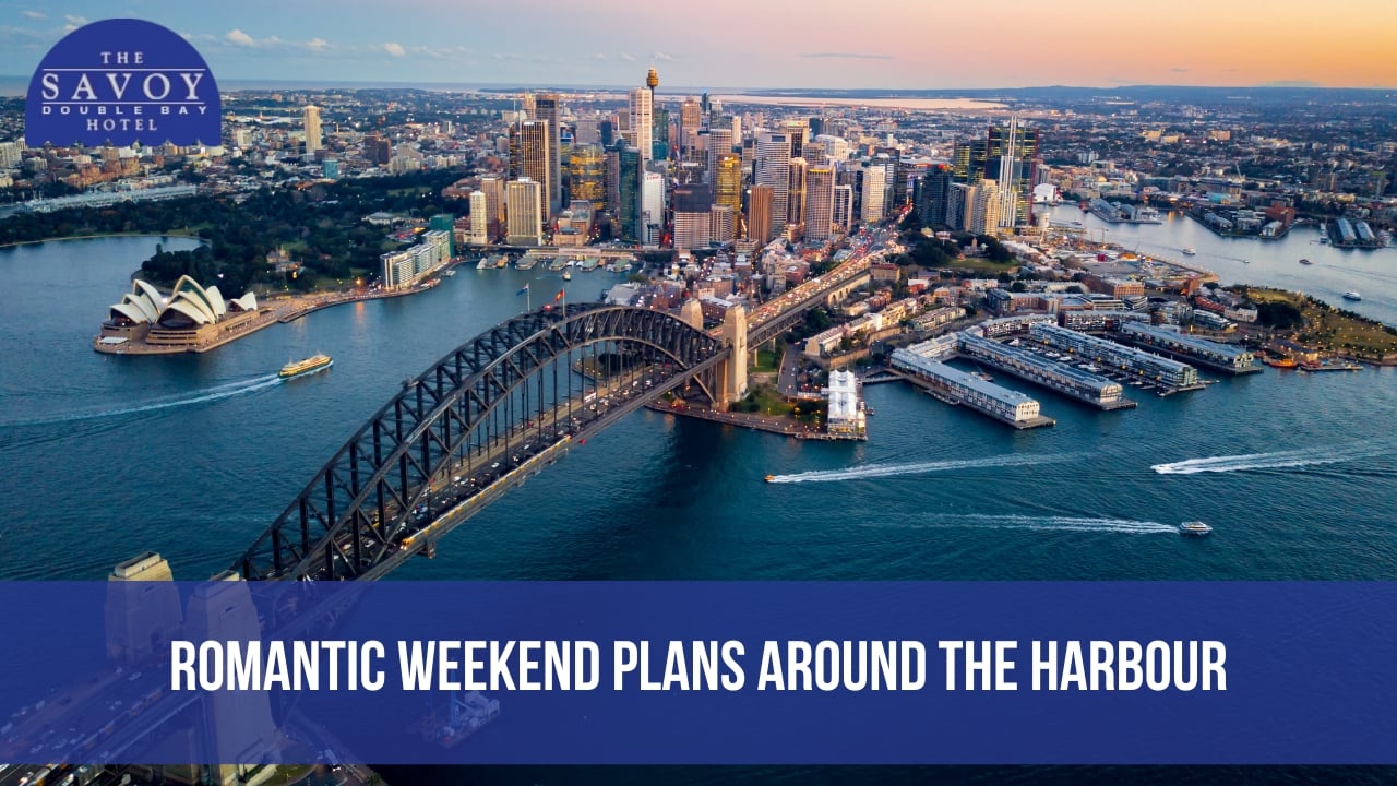 An aerial shot of the Sydney Harbour Bridge and Opera House at sunset.