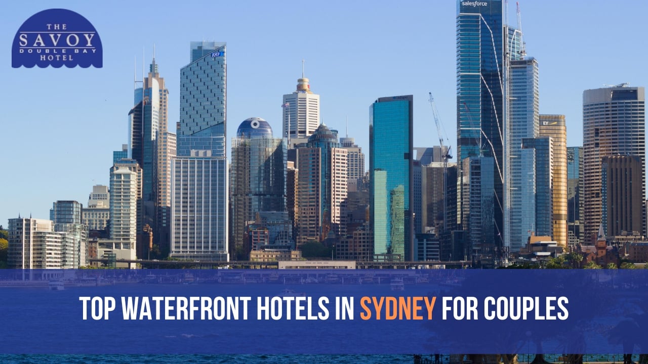 A scenic shot of the dense Sydney CBD skyscraper skyline across the blue harbour water