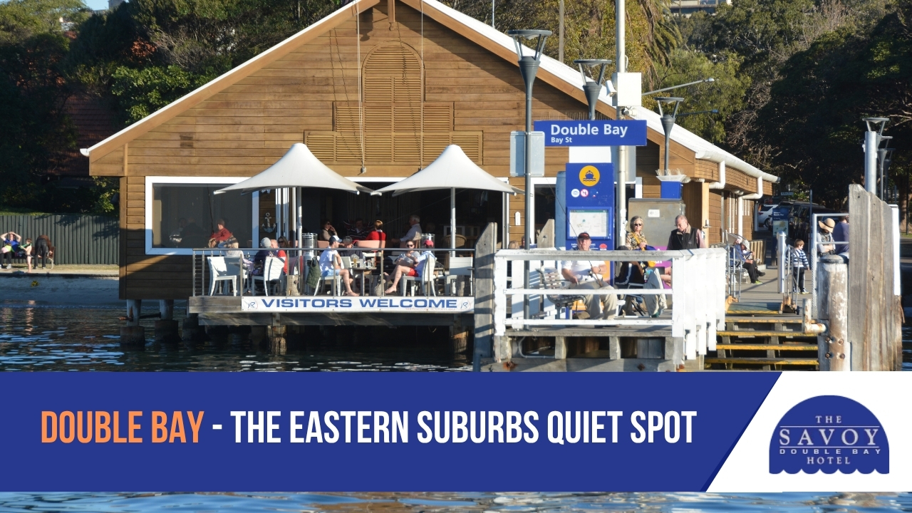 Best Neighbourhoods in Sydney for a Quiet Stay - Sydney A wooden wharf building at Double Bay, Sydney with people seated at outdoor tables